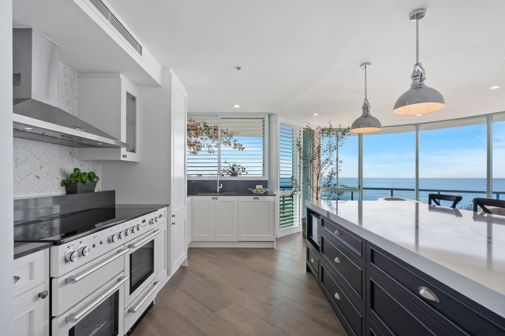 New modern hamptons style kitchen renovation with a nice view of the beach