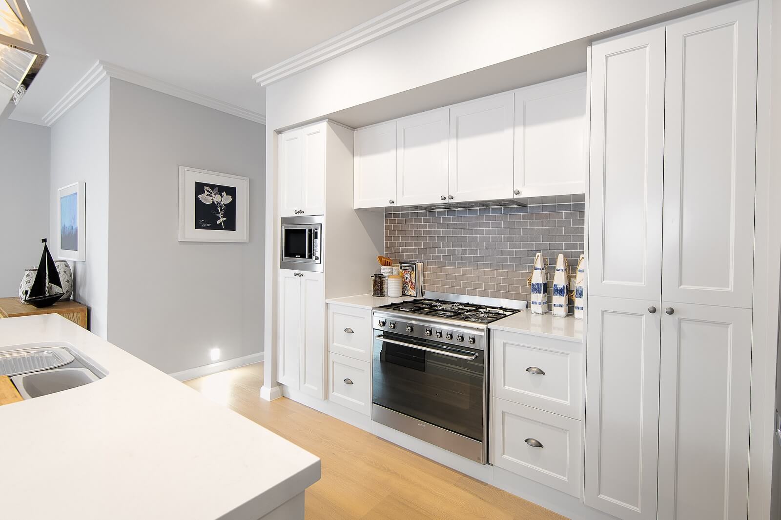 luxury kitchen renovation with breaks splash back and white cabinet gold coast banner
