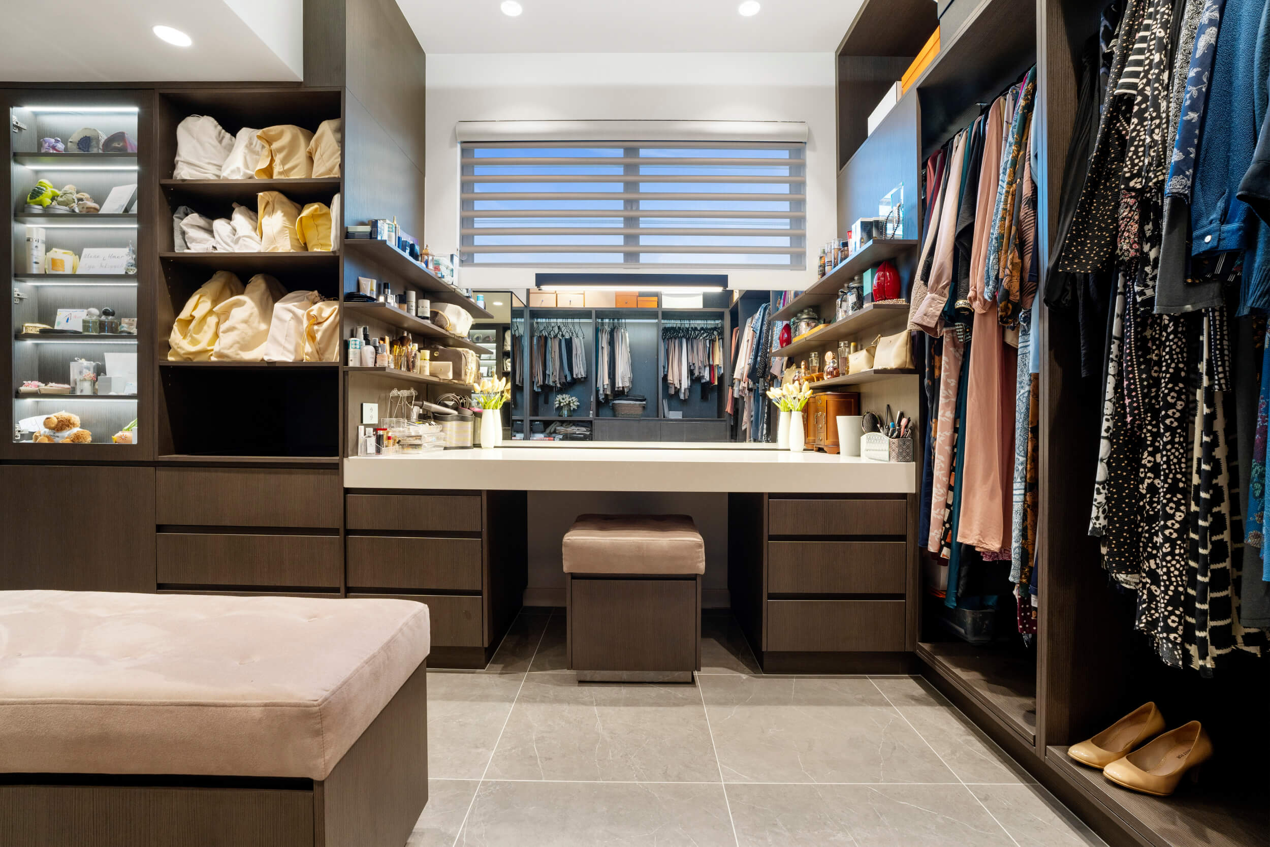 walk in closet and a counter in gold coast custom wardrobe renovation