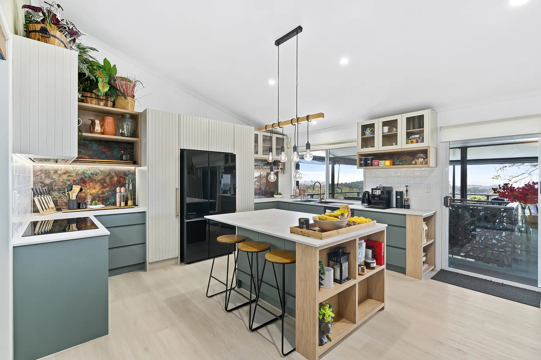 Modern Gold Coast kitchen renovation showcasing stylish design with skyline view, embodying a blend of aesthetics and practicality