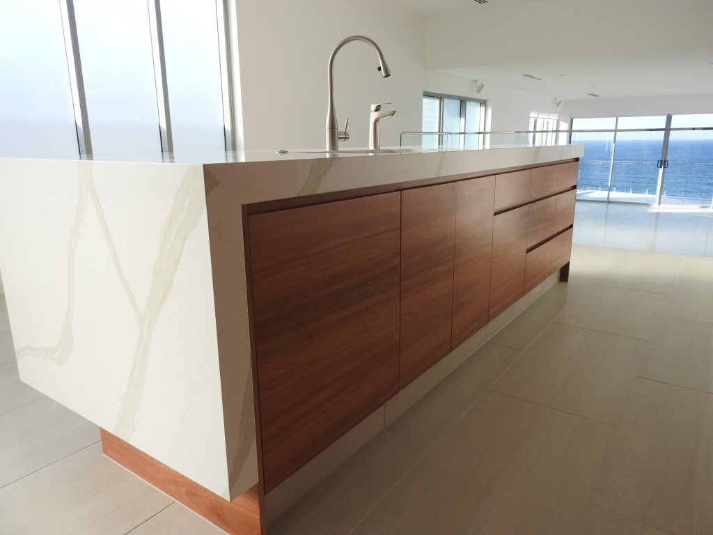 custom wood marble and white kitchen renovation in Gold coast luxury apartment